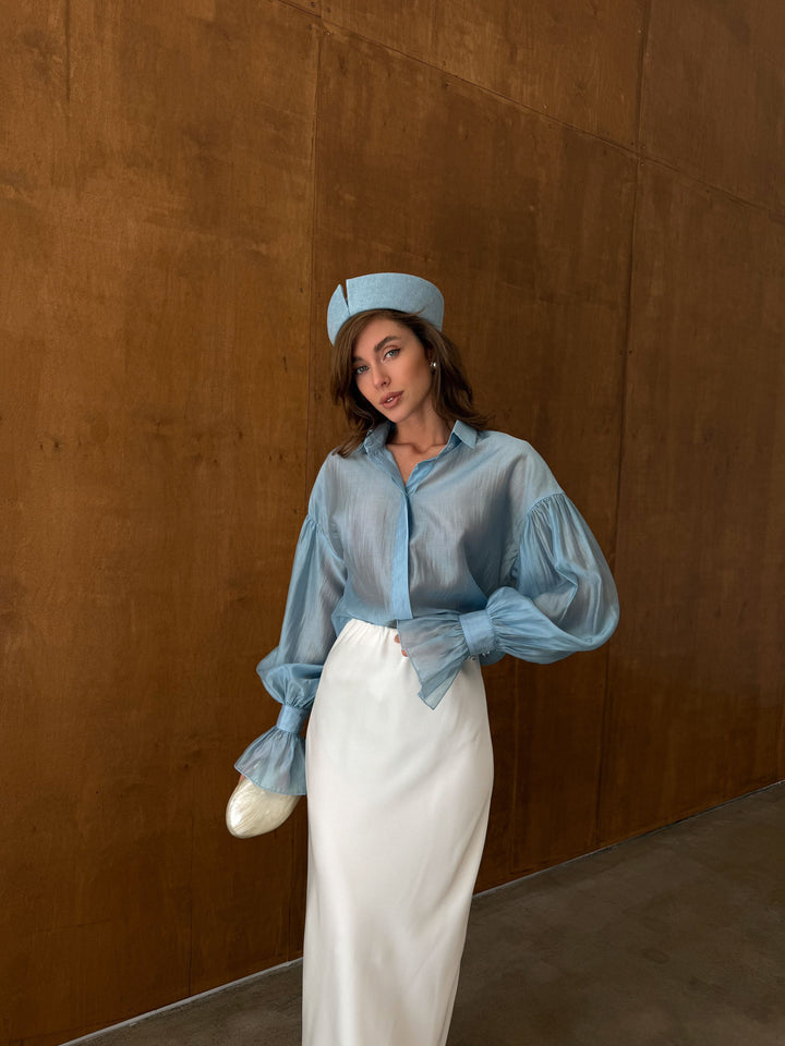 Full-length front view of the ice blue sheer lyocell blouse with tailored collar and long sleeves