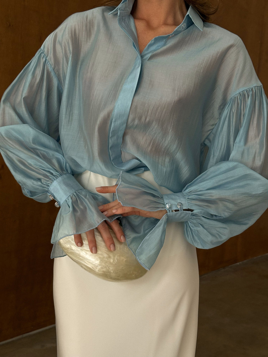 Full-length front view of the ice blue sheer lyocell blouse with tailored collar and long sleeves — EvolveUA