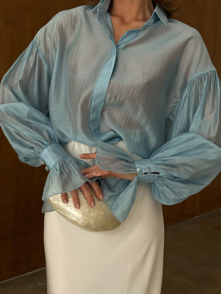 Full-length front view of the ice blue sheer lyocell blouse with tailored collar and long sleeves — EvolveUA