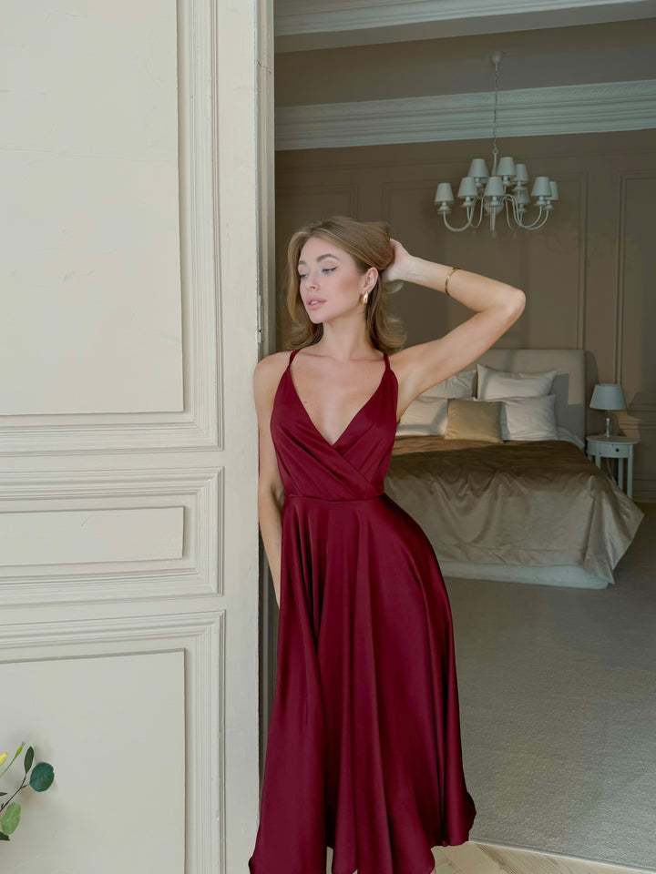 Burgundy silk slip midi dress with deep V-neck and flared midi skirt — ideal for formal dinners, winter weddings or cocktail events