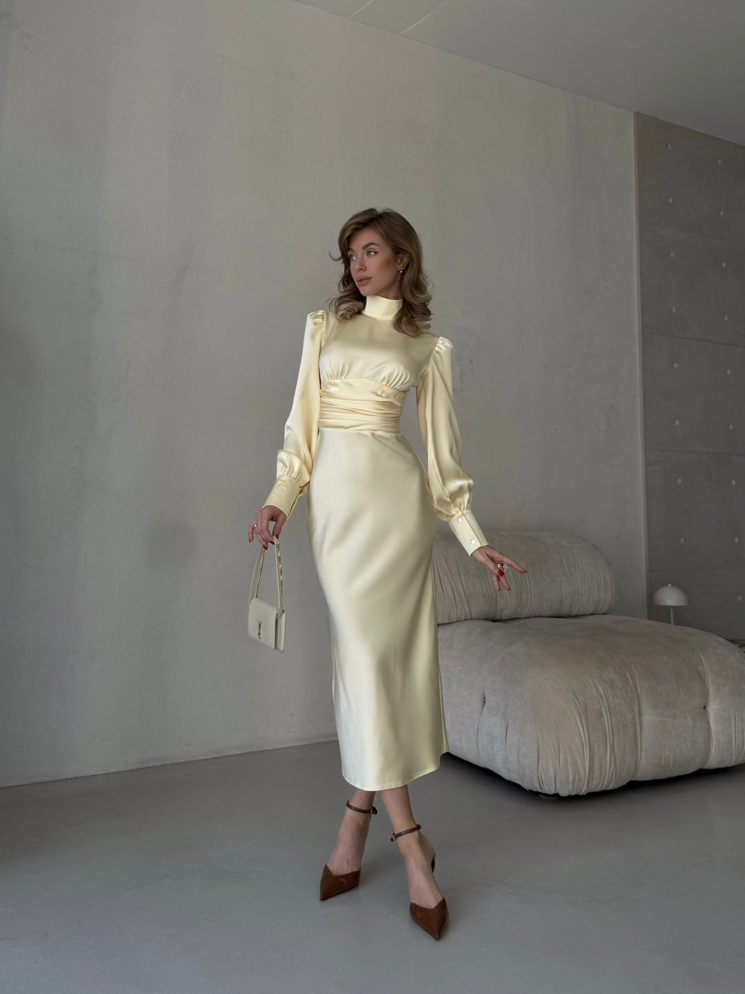 sophisticated butter yellow silk satin midi dress featuring a high neckline for a modern prom or formal dance look