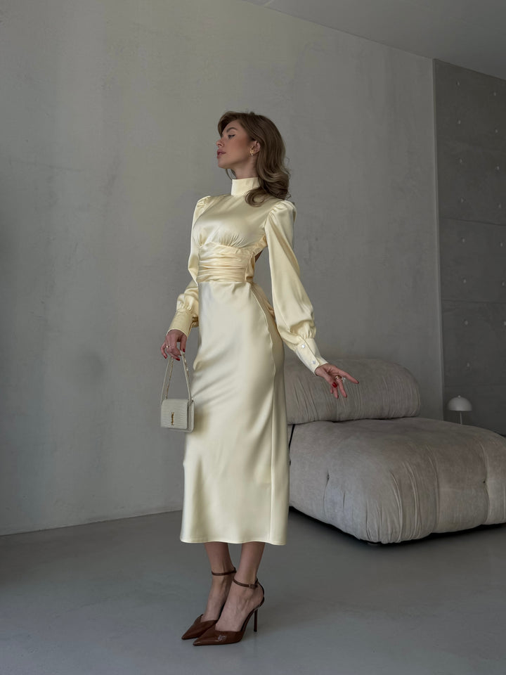 elegant butter yellow silk slip dress with long sleeves ideal for a chic spring or summer bridesmaid outfit