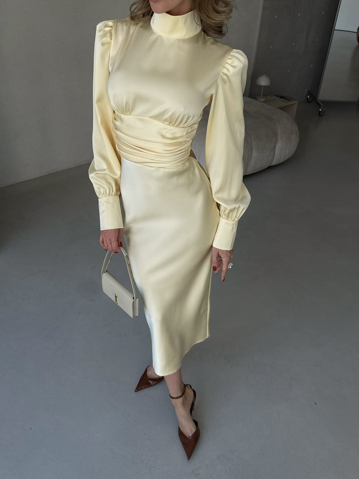 romantic butter yellow silk open back dress with beautiful drape perfect for a couple's engagement photoshoot
