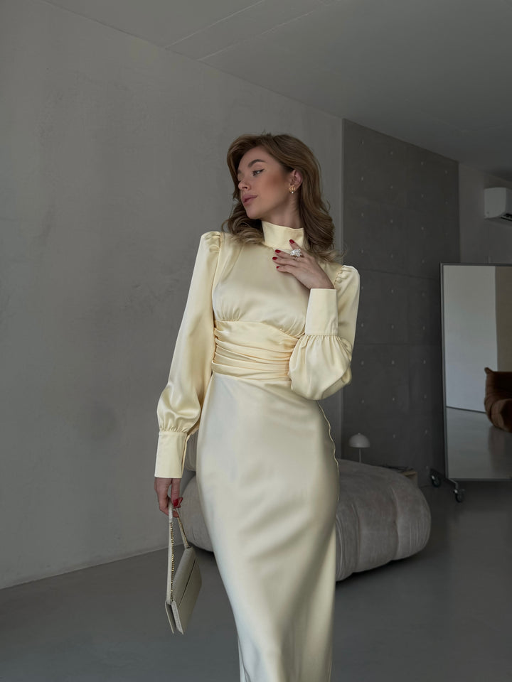 chic butter yellow silk satin midi dress providing a sophisticated look for an upscale summer party