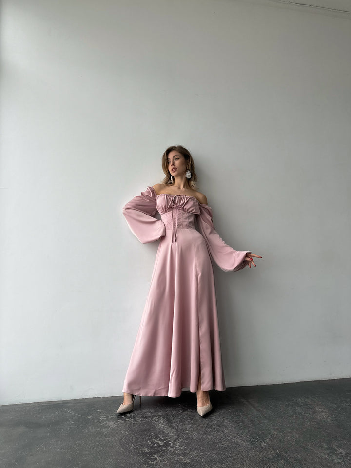 Long-sleeve light pink silk-blend formal dress highlighting a fitted bodice and sweeping maxi skirt. Ideal for an upscale bridesmaid dress look.