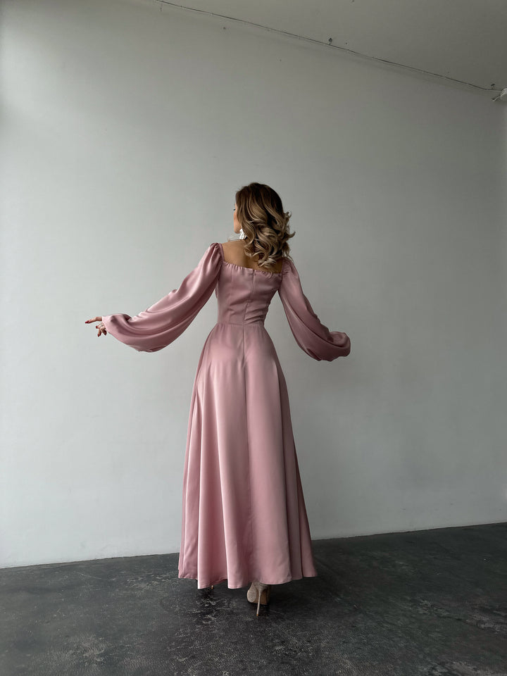 Chic dusty pink silk formal maxi dress with on-or-off shoulder puff sleeves. A vibrant aesthetic perfect for a fashionable NYC cocktail dress.