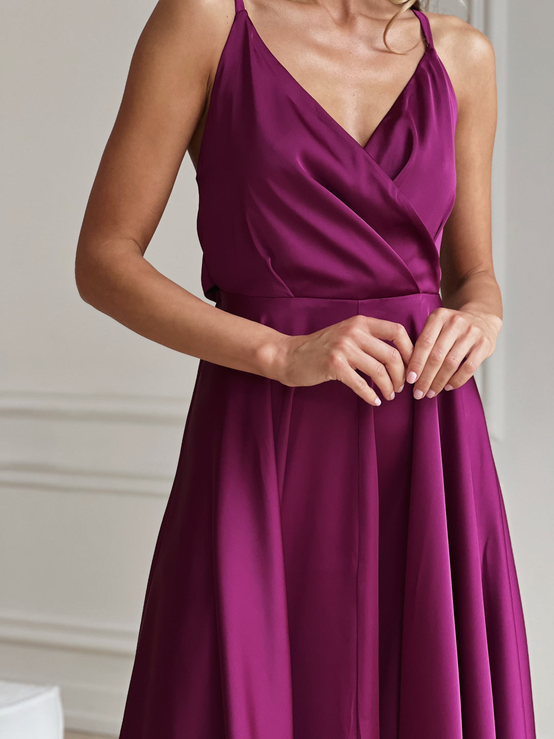 Side profile of fuchsia silk slip dress with adjustable shoulder straps