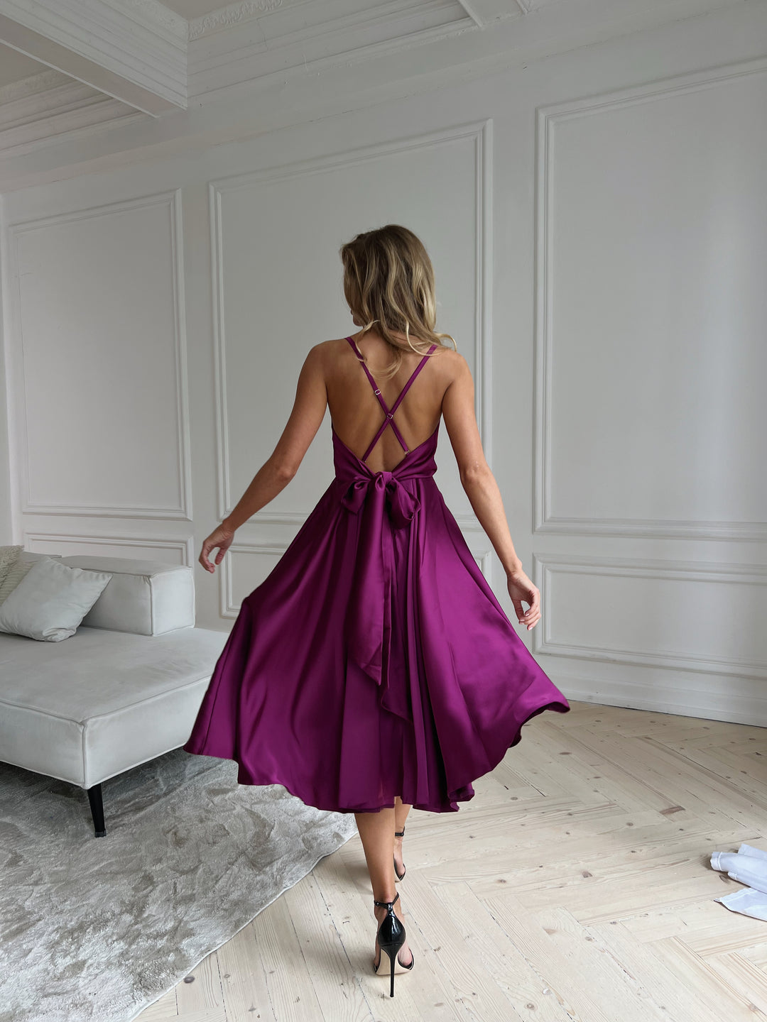 Fuchsia silk slip dress with V-neckline and flowing midi skirt
