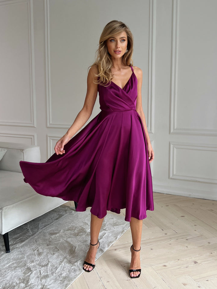 Fuchsia pink silk slip midi dress with deep V-neck and open bow back — front view