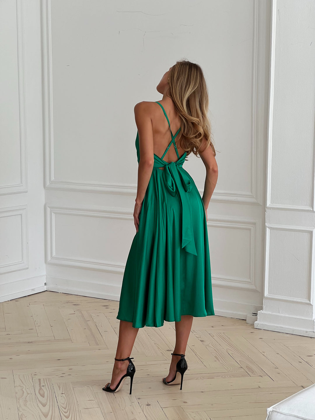 Grass green satin slip dress with flowing silhouette — styled look