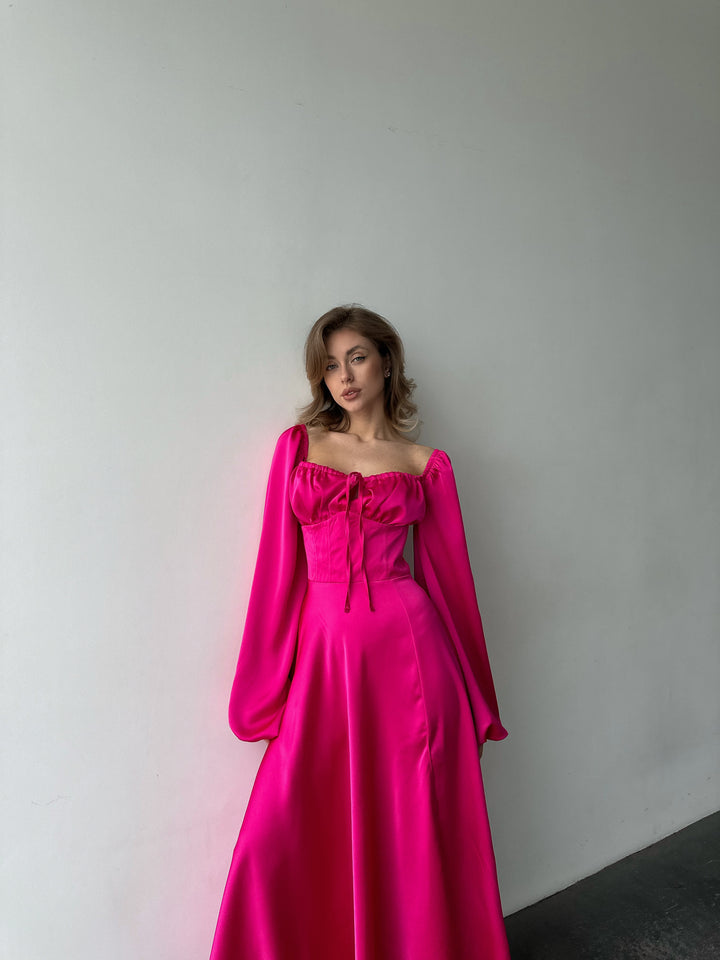 Chic hot pink silk formal maxi dress with on-or-off shoulder puff sleeves. A vibrant aesthetic perfect for a fashionable LA style cocktail dress look.