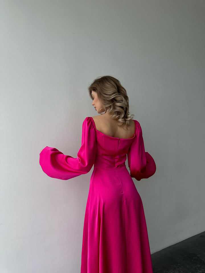 Premium hot pink silk-like maxi dress featuring delicate draped sleeves and a leg slit. An elegant outfit choice for a stylish destination vacation.
