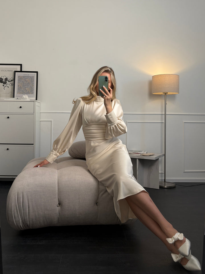 Refined ivory satin midi dress with long sleeves and bow tie neckline, elegant bridal outfit for modern minimalist wedding style