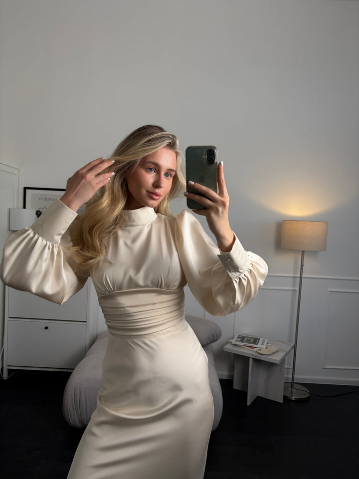 Ivory satin midi dress with clean silhouette and bow tie neckline, sophisticated choice for modern bride or formal occasion outfit