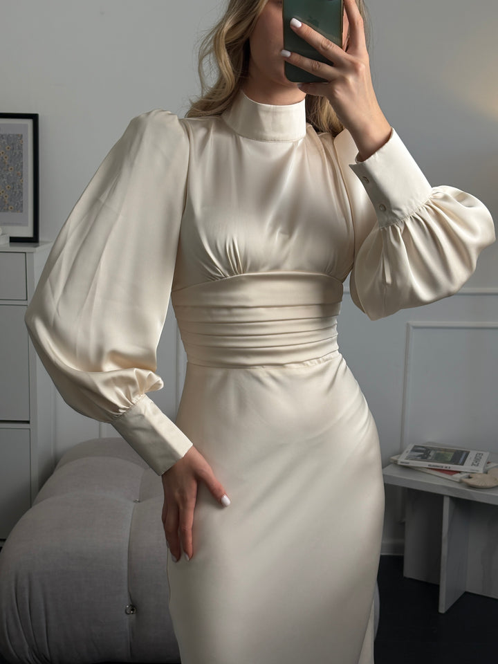 Ivory satin long sleeve midi dress with bow tie neckline and clean lines, ideal for courthouse wedding or minimalist bridal look