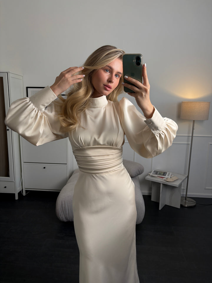Minimalist ivory satin midi dress with long sleeves and bow neckline, perfect for civil wedding, elopement, or elegant event look