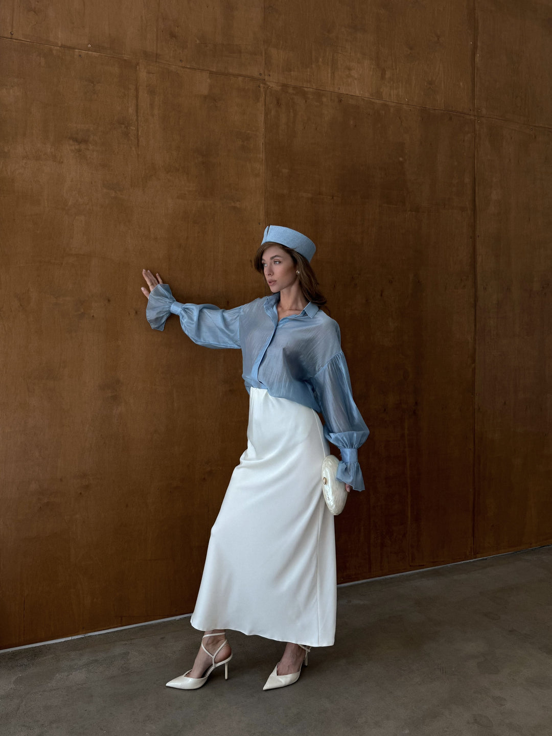 Ivory bias cut skirt with soft structure and polished look.