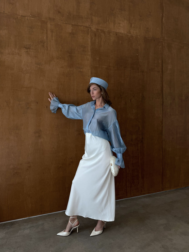 Ivory bias cut skirt with soft structure and polished look.