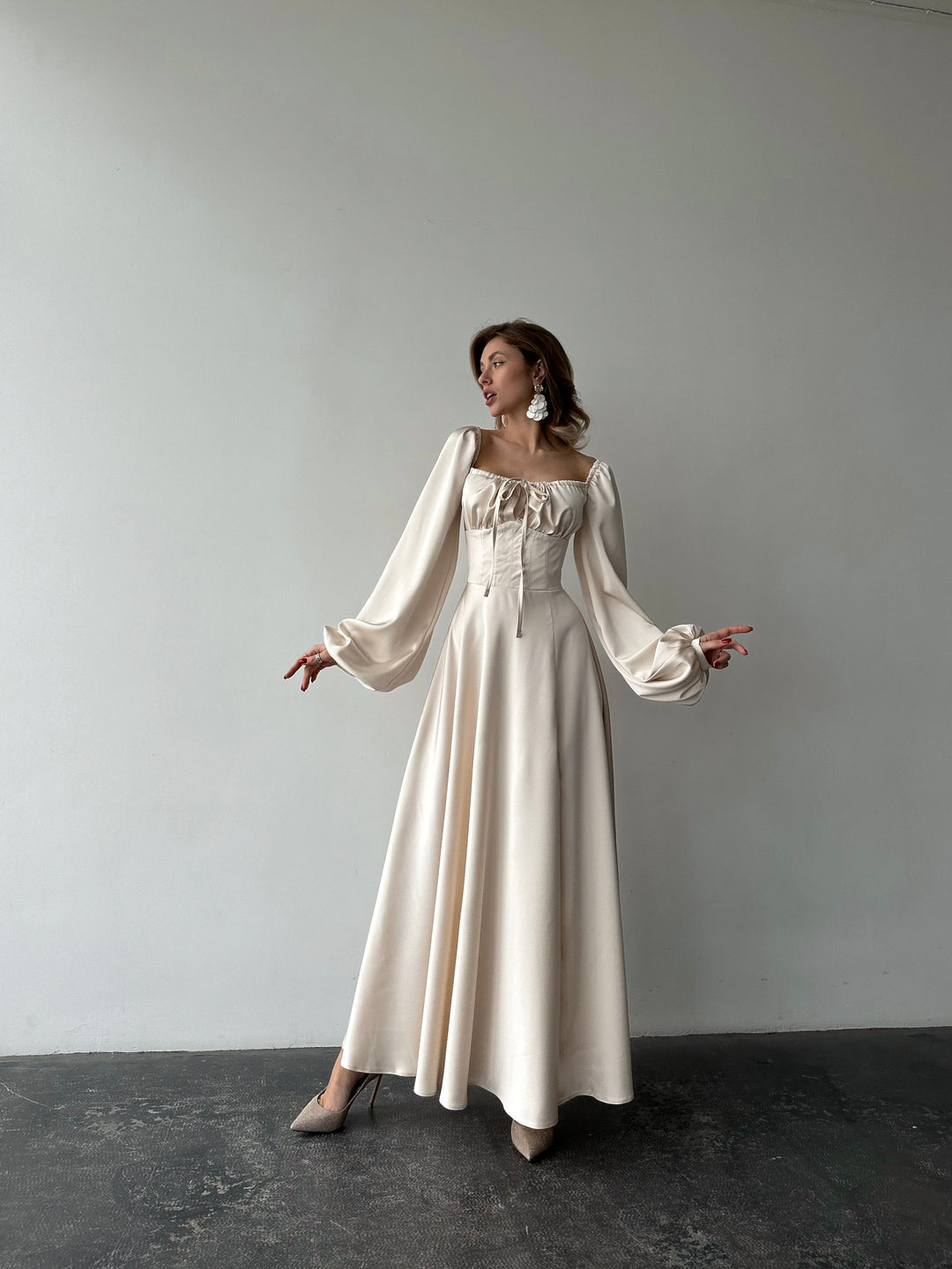 Ivory silk satin maxi dress front view — sweetheart neckline, bishop sleeves, floor-length silhouette. Elegant and feminine. Perfect for civil weddings, bridal parties, elopements, and formal gala evenings.