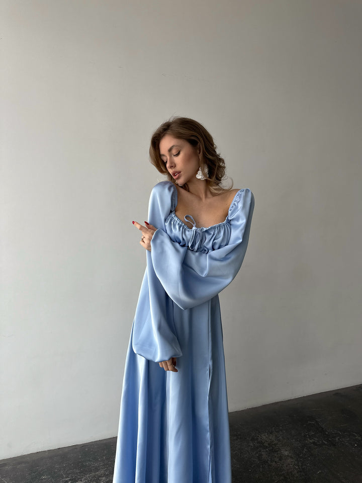 Flowing light blue satin gown with a classic sweetheart neckline, bishop sleeves, and a floor-sweeping skirt. A gorgeous spring formal dress ensemble.