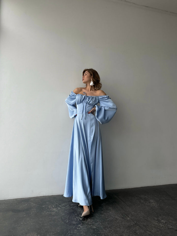 Elegant ice blue long-sleeve silk gown with a sweeping floor-length hem and sweetheart cut. An upscale option for a luxurious spring bridesmaid dress.