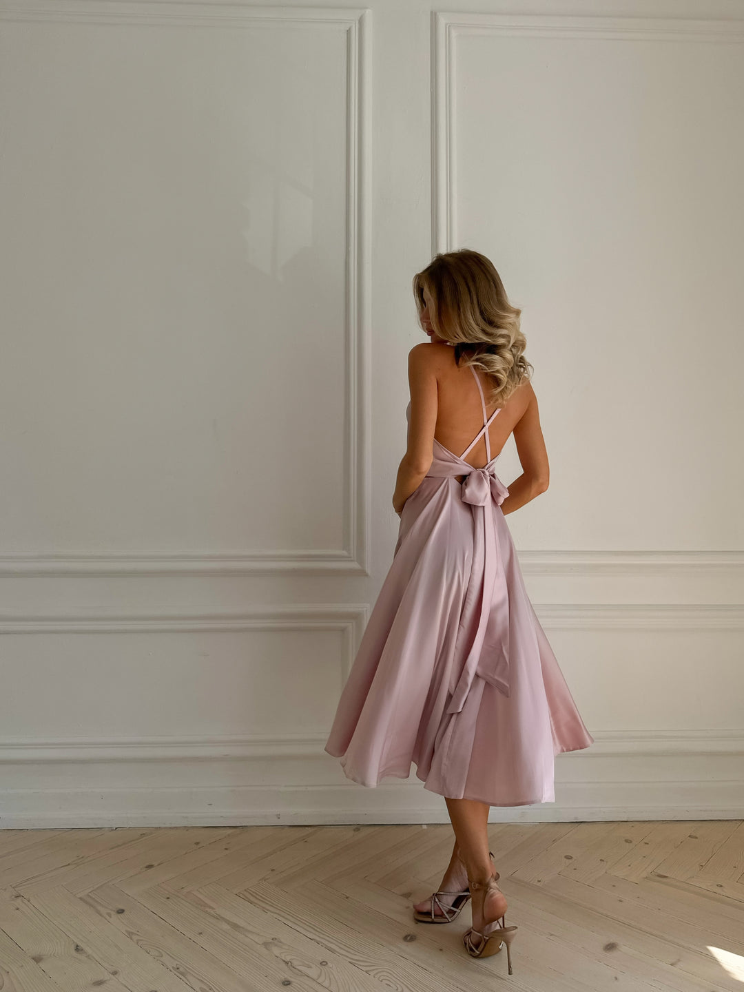 Light pink satin slip midi dress with V-neck bodice — full length view