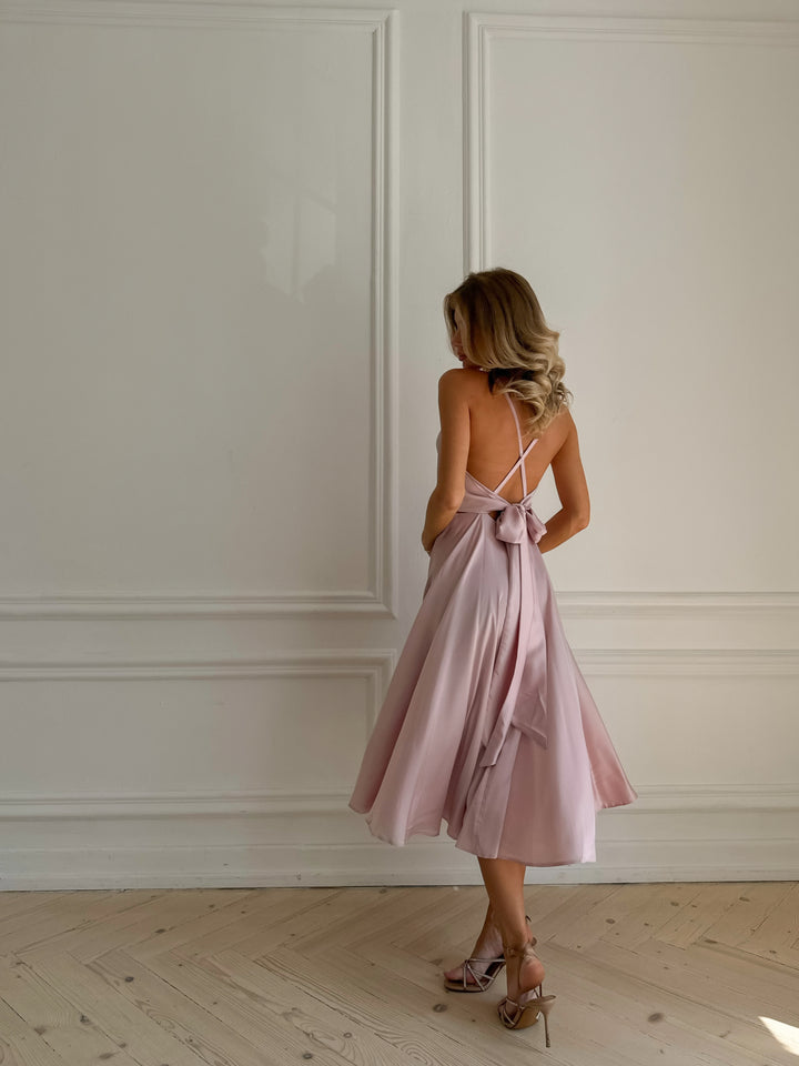 Light pink satin slip midi dress with V-neck bodice — full length view