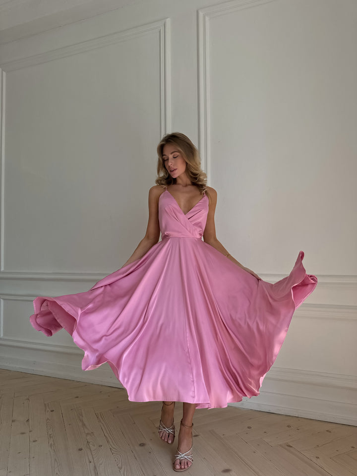 Mauve pink silk midi dress with V-neckline — movement and drape shot