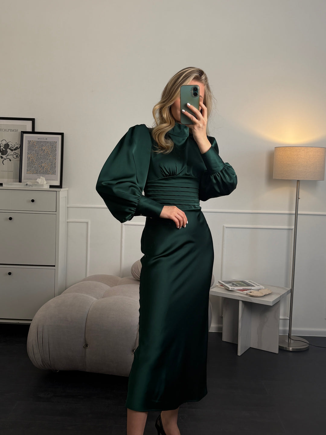 Side profile of modest emerald green midi dress with long sleeves — midi length, fitted silhouette
