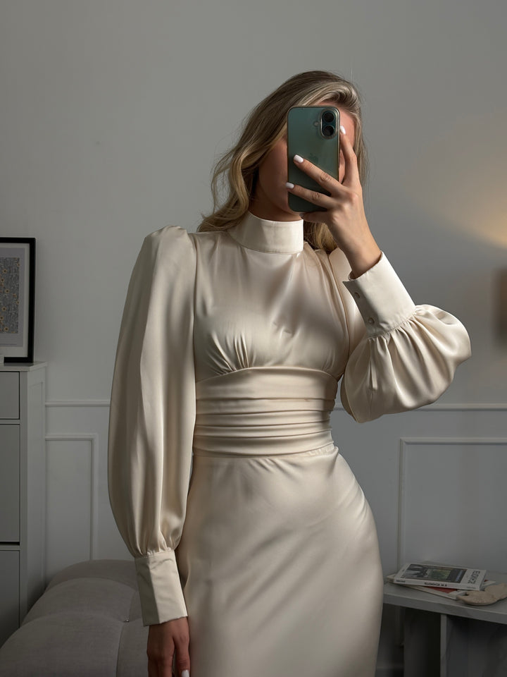 Ivory satin midi dress with structured silhouette and bow detail, elegant choice for elopement, bridal shower, or formal daytime event