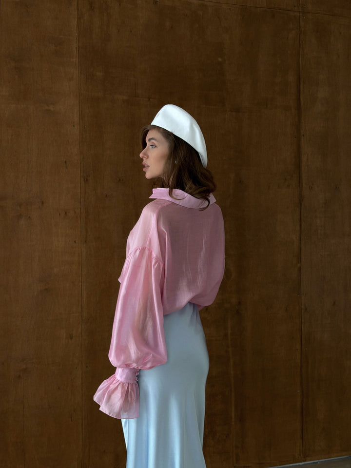 Back view of pink sheer blouse with dropped shoulders and clean yoke construction