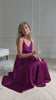 Fuchsia silk slip midi dress with deep V-neck and open back modelled in motion — EvolveUA