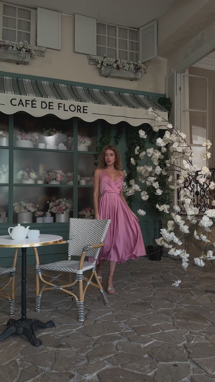 Dusty pink silk slip midi dress with deep V-neck and open back modelled in motion — EvolveUA