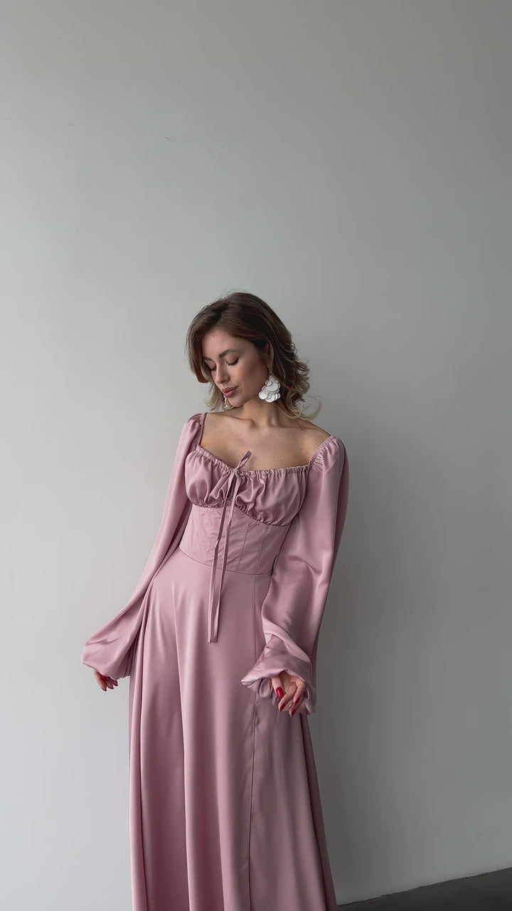 Dusty pink silk satin maxi dress with bishop sleeves and high leg slit modelled in motion — EvolveUA
