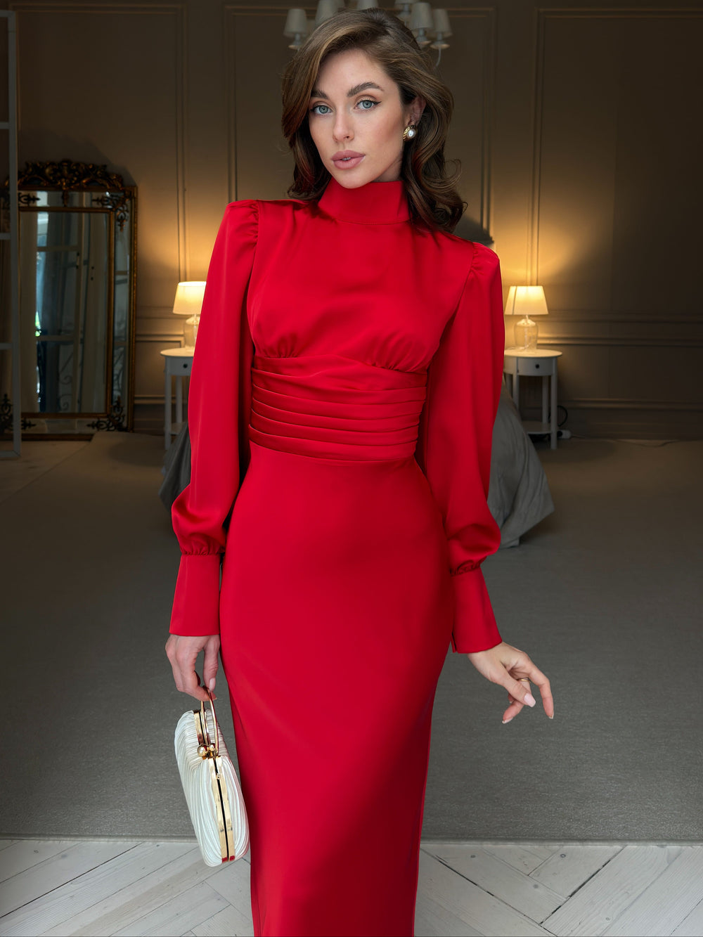 Red satin midi dress, front view from collar to skirt: gathered bodice, wide pleated corset-style waistband, long bishop sleeves and fitted pencil silhouette.