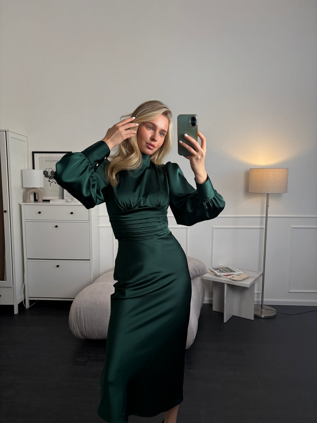 High neck detail with button closure on emerald green long sleeve midi dress
