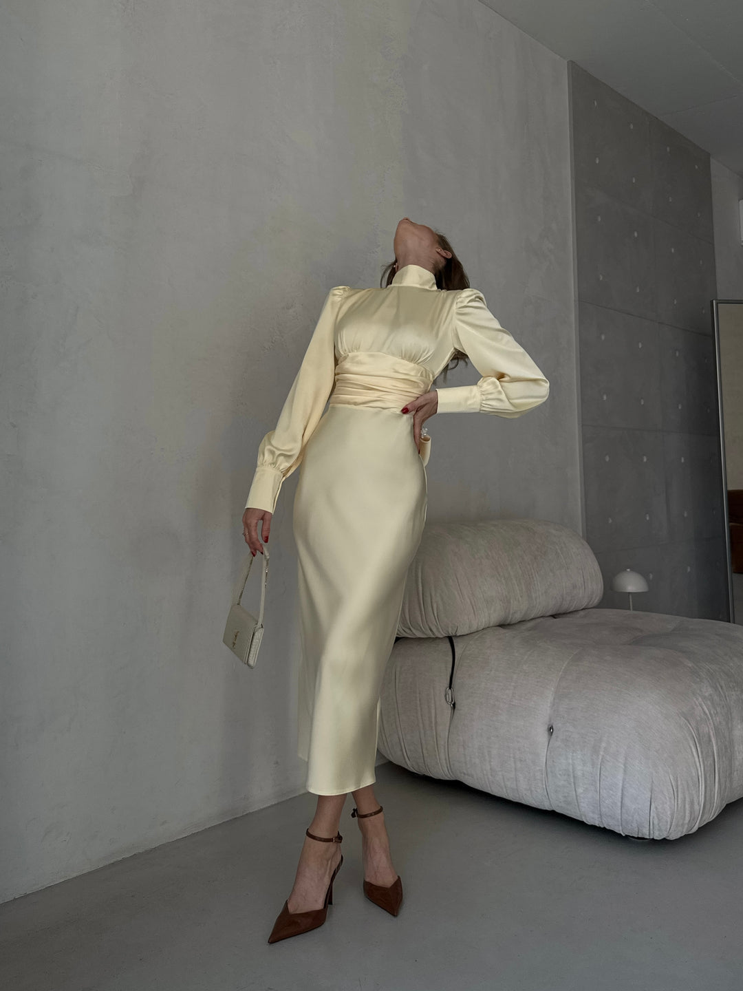 soft butter yellow silk dress featuring a modest high neck front perfectly balanced with a daring open back
