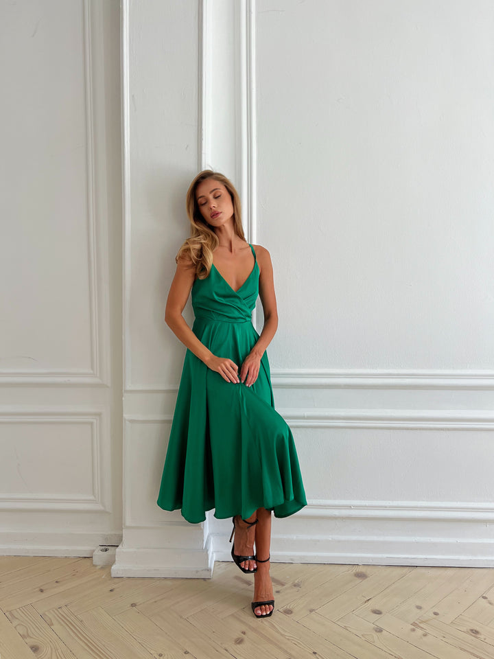 Vibrant green silk slip dress with elegant open bow back