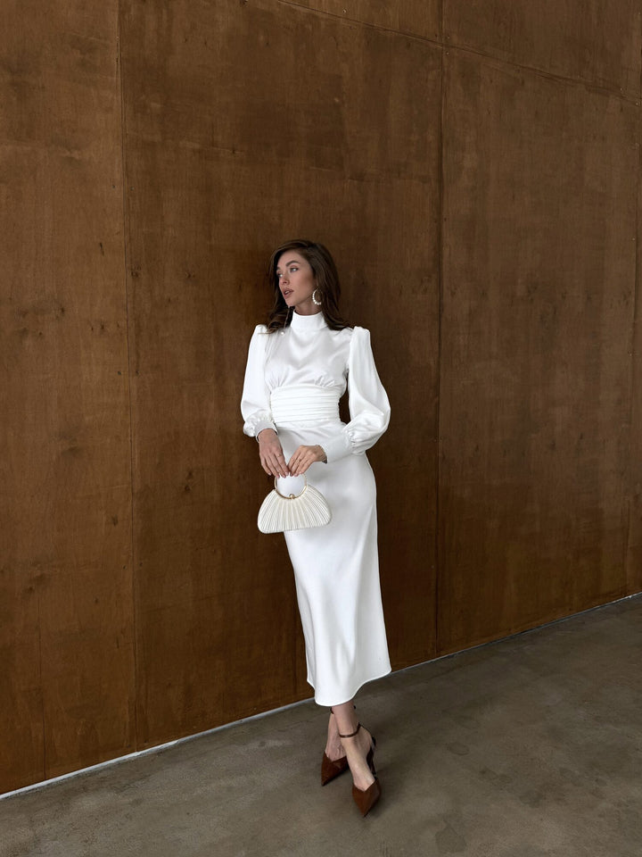 White satin midi dress with high neckline and bishop sleeves — full length elegant front view